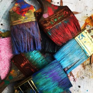 Paintbrushes covered in paint